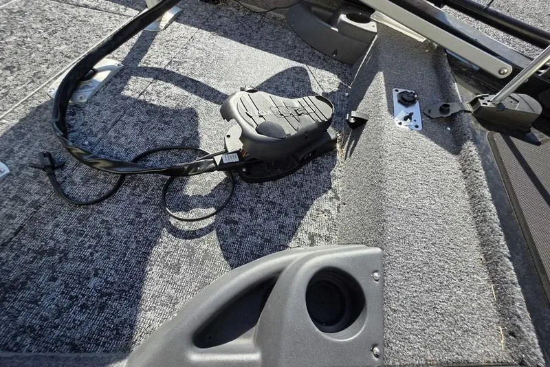 Slide: The Image of 2025 Tracker Pro Team 175 Crappie Edition boat deck with seating and cable. - 13