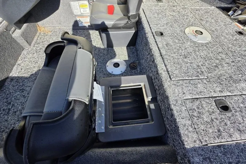 Slide: The Image of Carpeted deck of 2025 Tracker Pro Team 175 Crappie Edition boat with seat mounts. - 17