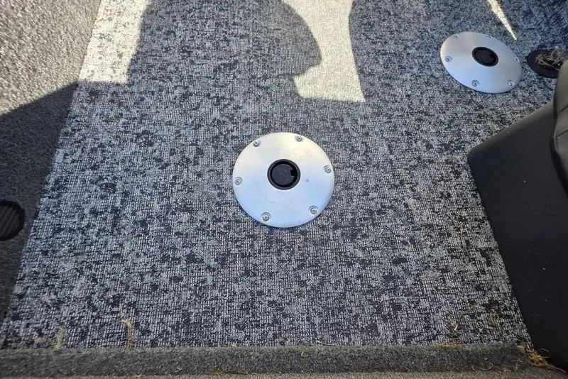 Slide: The Image of 2025 Tracker Pro Team 175 Crappie Edition boat storage compartment with yellow lid. - 19