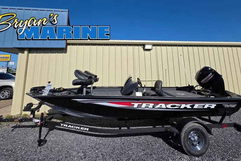 Slide: The Image of Control panel on 2025 Tracker Pro Team 175 Crappie Edition boat, featuring switches and carpeted surface. - 8