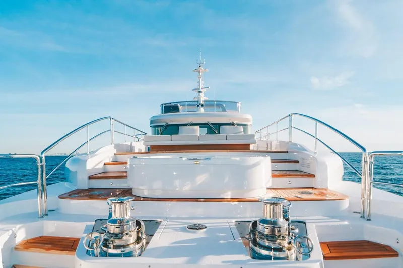 Slide: The Image of Luxurious 2020 Benetti Delfino yacht deck with sleek design and ocean backdrop. - 9