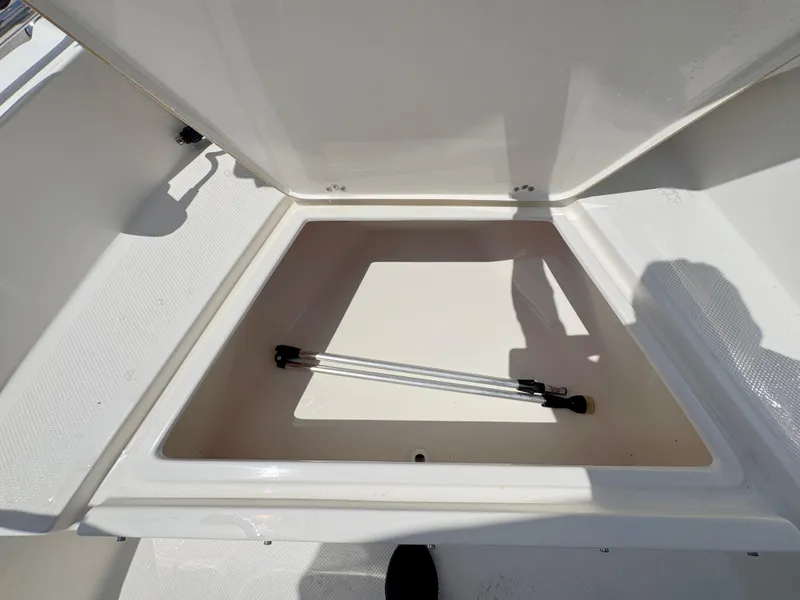 Slide: The Image of Open storage compartment on 2016 Key West 1720 Center Console boat. - 10