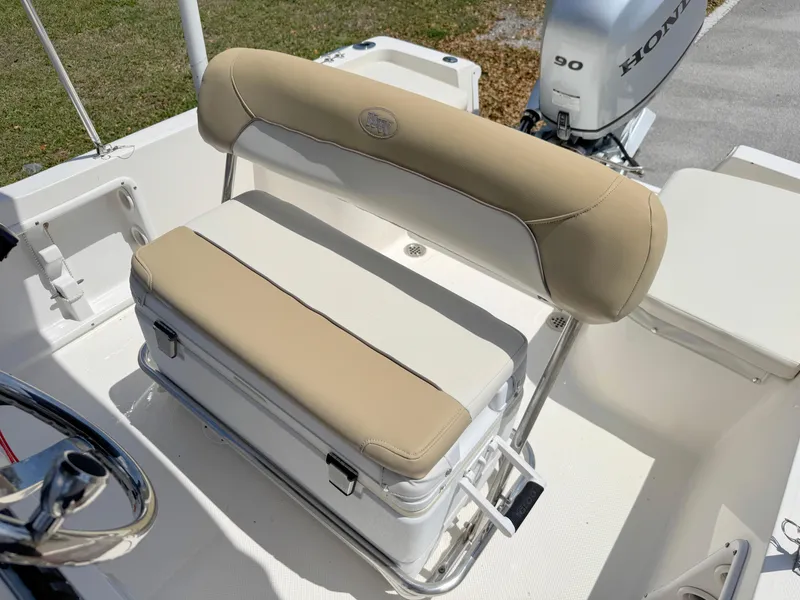 Slide: The Image of 2016 Key West 1720 Center Console boat seat with beige and white cushions. - 14