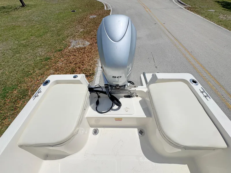 Slide: The Image of 2016 Key West 1720 Center Console boat with outboard motor on a road. - 18