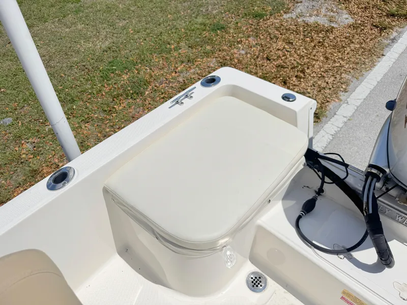 Slide: The Image of 2016 Key West 1720 Center Console boat seat and storage area. - 19