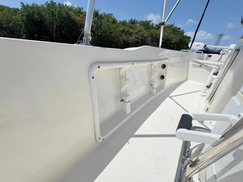 Slide: The Image of 2016 Key West 1720 Center Console boat deck with white interior and railing. - 22