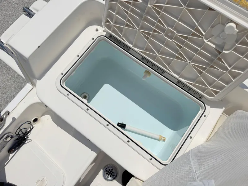 Slide: The Image of Open storage compartment on 2016 Key West 1720 Center Console boat. - 23