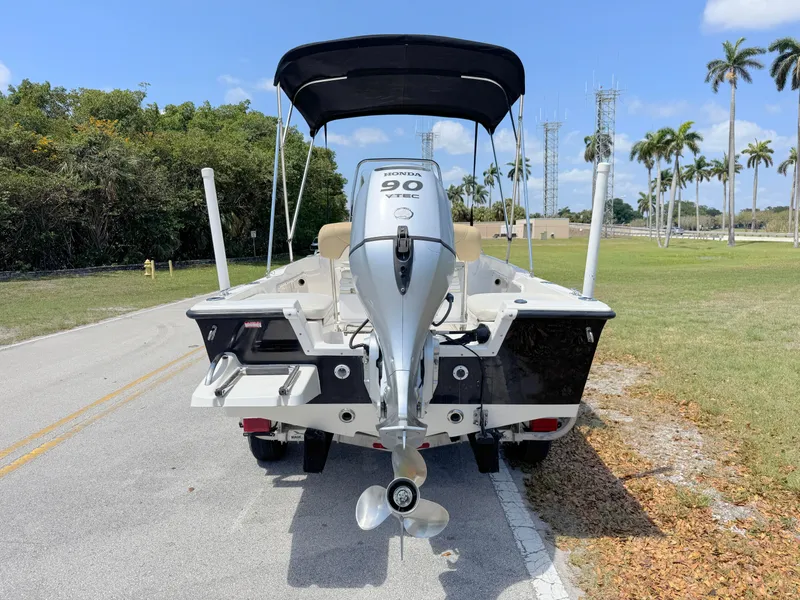 Slide: The Image of 2016 Key West 1720 Center Console boat with Honda 90 engine on a sunny day. - 3