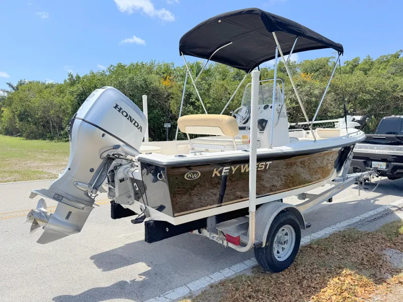 Slide: The Image of 2016 Key West 1720 Center Console boat with Honda outboard motor on trailer. - 4