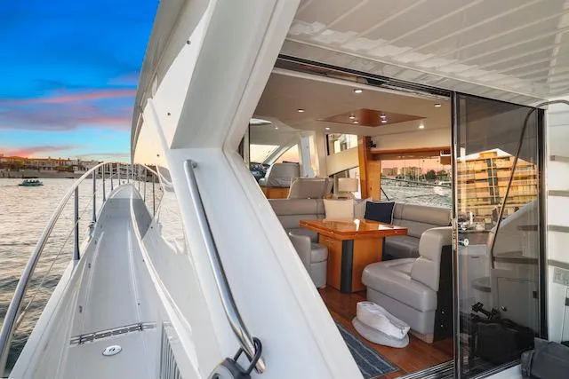 Slide: The Image of 2008 Sunseeker Manhattan 60 yacht interior with luxurious seating and ocean view. - 12