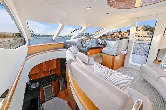 Slide: The Image of Luxurious interior of 2008 Sunseeker Manhattan 60 yacht with modern seating and panoramic windows. - 21