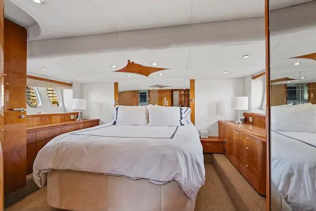 Slide: The Image of Luxurious bedroom interior of 2008 Sunseeker Manhattan 60 yacht with elegant wood finishes. - 25