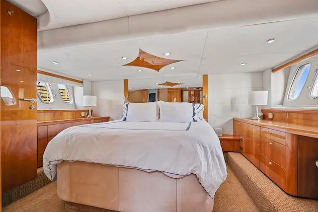 Slide: The Image of Luxurious bedroom interior of 2008 Sunseeker Manhattan 60 yacht with elegant wood finishes. - 26
