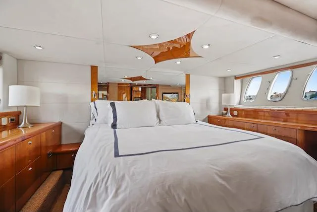 Slide: The Image of Luxurious bedroom interior of 2008 Sunseeker Manhattan 60 yacht with elegant wood finishes. - 27