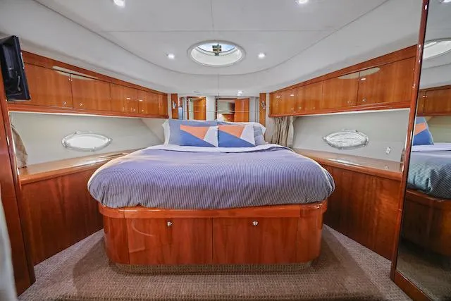 Slide: The Image of Luxurious cabin interior of 2008 Sunseeker Manhattan 60 yacht with elegant wood finish. - 33
