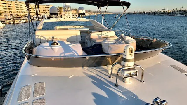 Slide: The Image of 2008 Sunseeker Manhattan 60 yacht on water, featuring spacious deck and luxurious seating. - 38