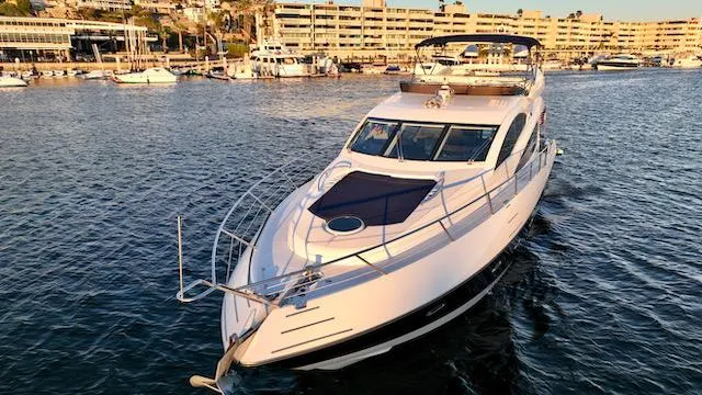 Slide: The Image of 2008 Sunseeker Manhattan 60 yacht cruising in a marina, showcasing luxury and elegance. - 39