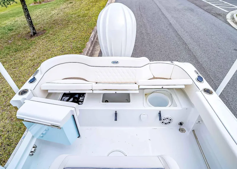 Slide: The Image of 2025 Sea Hunt Ultra 245 SE boat interior with seating and storage compartments. - 8