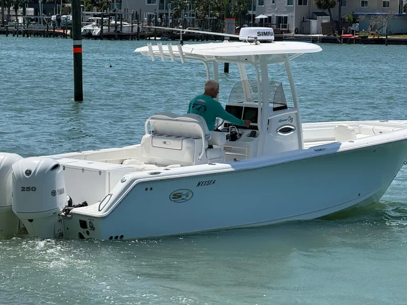 Slide: The Image of 2016 Sea Hunt Gamefish 27 boat cruising in clear blue waters. - 36