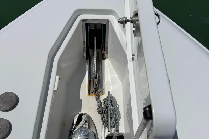 Slide: The Image of Anchor compartment of 2016 Sea Hunt Gamefish 27 boat with chain and winch. - 37
