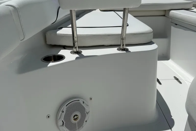 Slide: The Image of 2016 Sea Hunt Gamefish 27 boat interior with seating and speaker. - 46