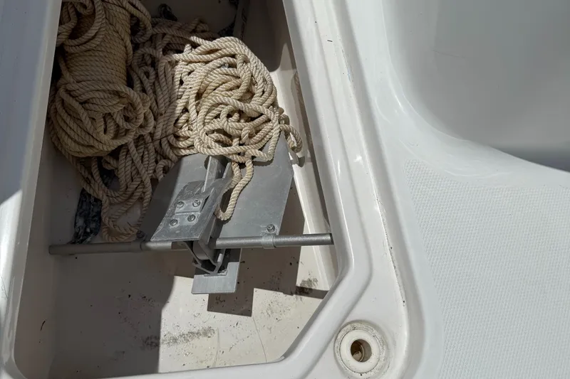 Slide: The Image of 2016 Sea Hunt Gamefish 27 anchor storage with coiled rope. - 49