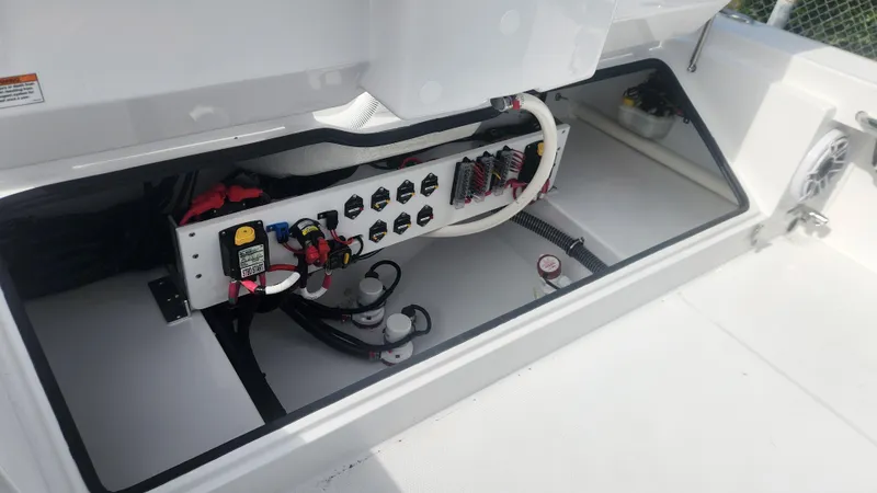 Slide: The Image of 2025 Everglades 253 Center Console boat electrical panel with wiring and components. - 11