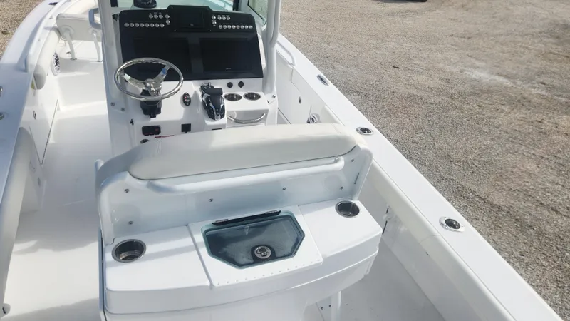 Slide: The Image of 2025 Everglades 253 Center Console boat interior with steering wheel and seating. - 4