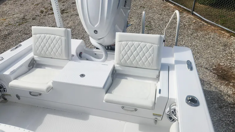 Slide: The Image of 2025 Everglades 253 Center Console boat with white cushioned seating and sleek design. - 9
