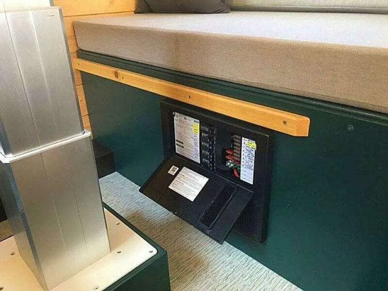 Slide: The Image of Built-in electrical panel under a cushioned bench in a modern interior, Custom model 25, 2023. - 20