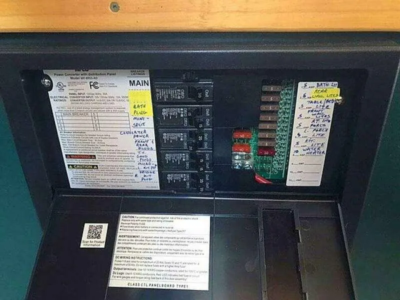 Slide: The Image of Electrical panel with labeled circuits and fuses, Custom model 25, 2023. - 26