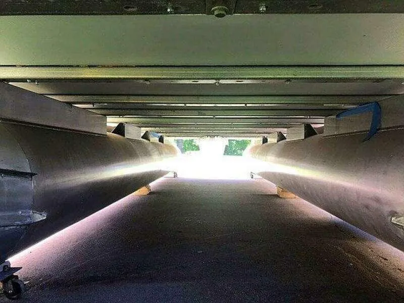 Slide: The Image of Underneath view of a Custom 25 pontoon boat, 2023 model, showing twin hulls. - 27