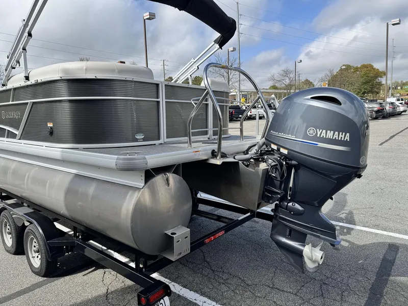 Slide: The Image of 2021 Godfrey Sweetwater 2286 SBX pontoon boat with Yamaha outboard motor on trailer. - 5