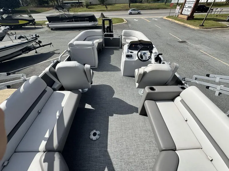 Slide: The Image of 2021 Godfrey Sweetwater 2286 SBX pontoon boat interior with spacious seating and steering console. - 7
