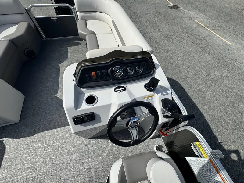Slide: The Image of 2021 Godfrey Sweetwater 2286 SBX boat interior with steering console and seating. - 9