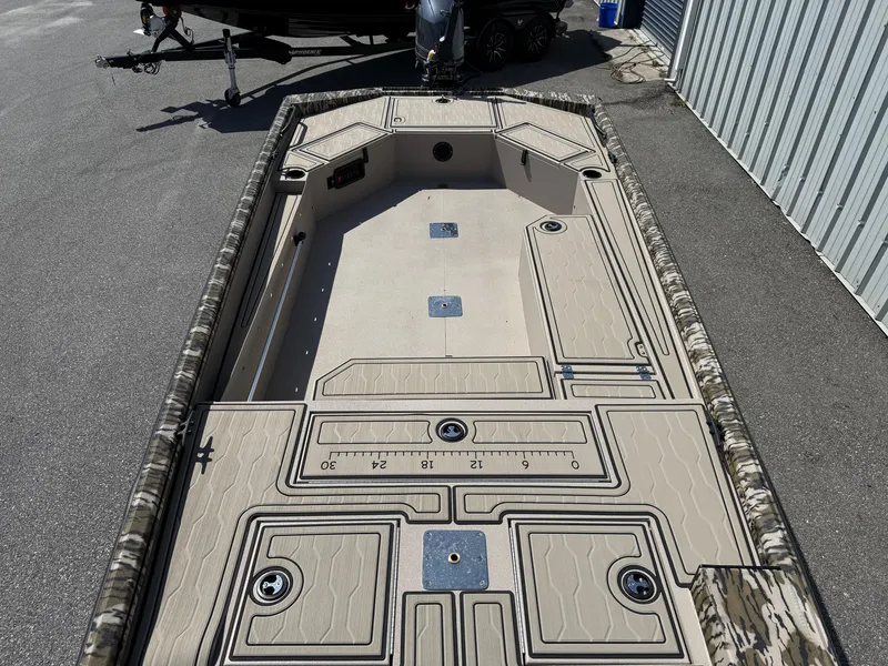 Slide: The Image of 2025 Avid 18 Commander boat interior with spacious deck and storage compartments. - 6