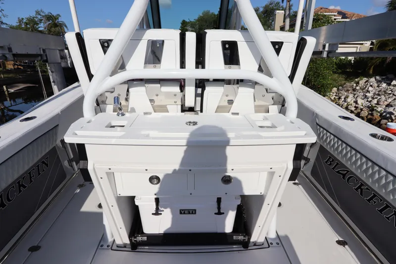 Slide: The Image of 2023 Blackfin 272 CC boat interior with seating and Yeti cooler. - 11