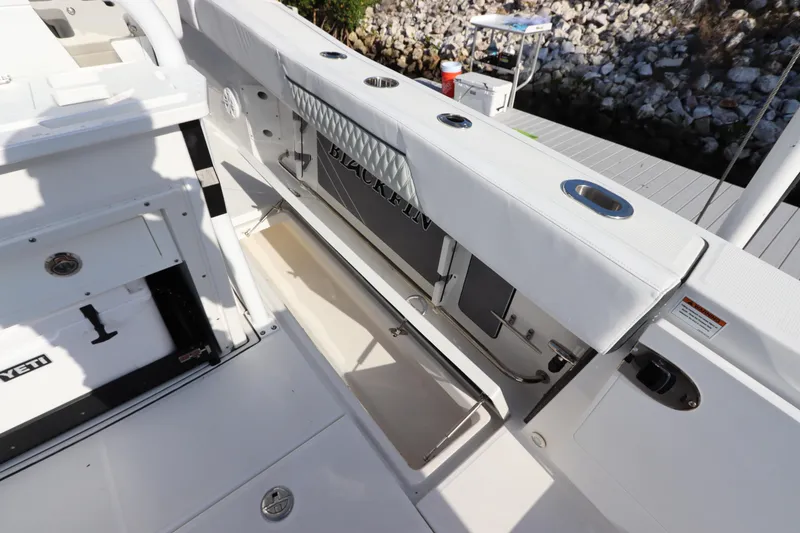 Slide: The Image of 2023 Blackfin 272 CC boat interior with storage compartment open. - 13