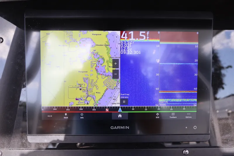 Slide: The Image of Garmin navigation display on 2023 Blackfin 272 CC boat, showing map and sonar data. - 23