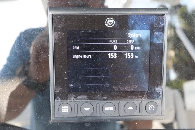 Slide: The Image of Display panel of 2023 Blackfin 272 CC showing 153 engine hours. - 25