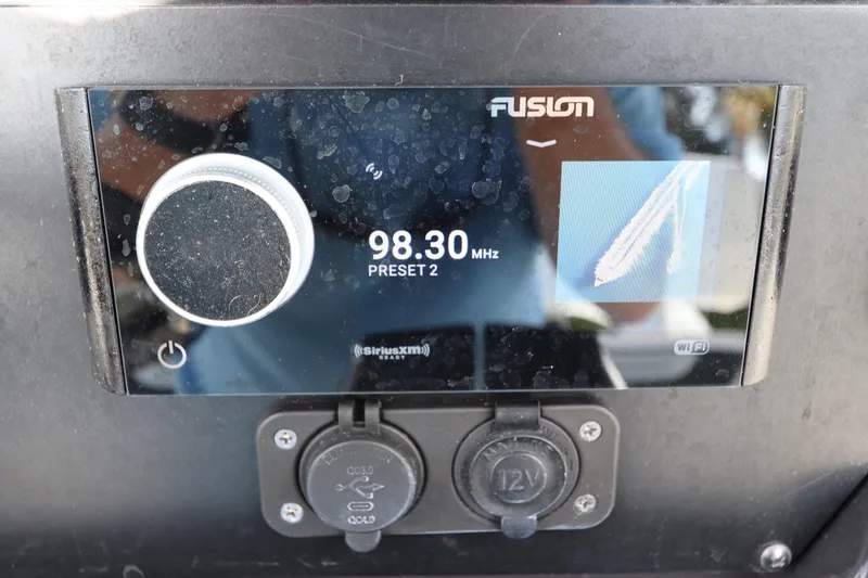Slide: The Image of Fusion radio display on 2023 Blackfin 272 CC, showing 98.30 MHz frequency. - 28