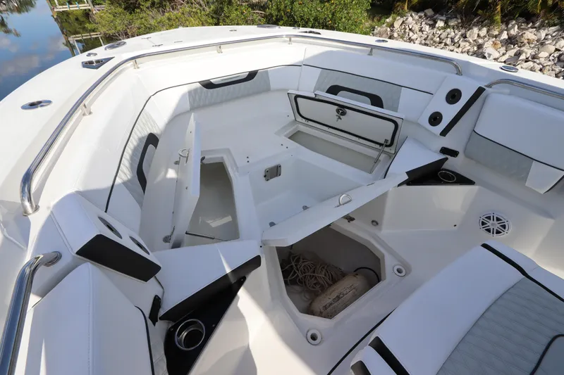 Slide: The Image of 2023 Blackfin 272 CC boat interior with open storage compartments and seating. - 31