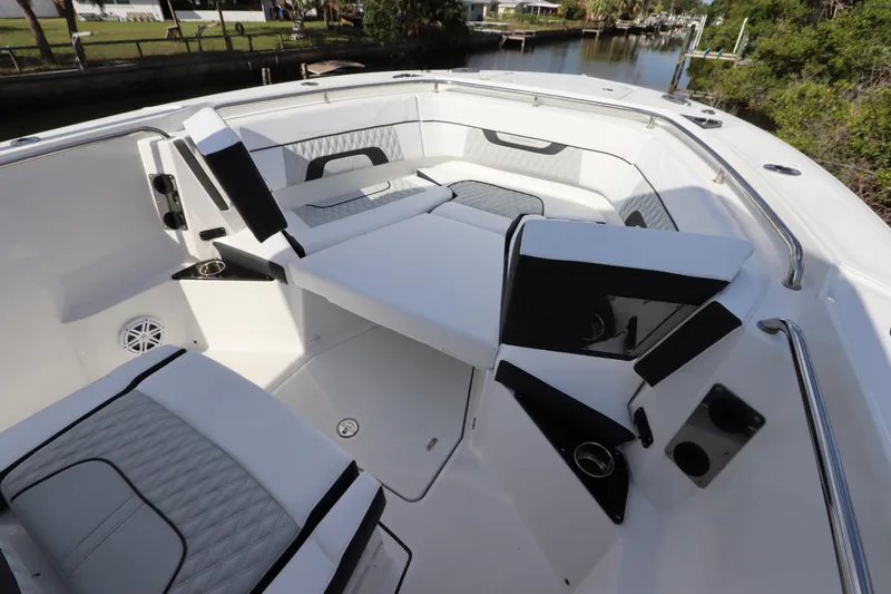 Slide: The Image of 2023 Blackfin 272 CC boat interior with cushioned seating and sleek design. - 33