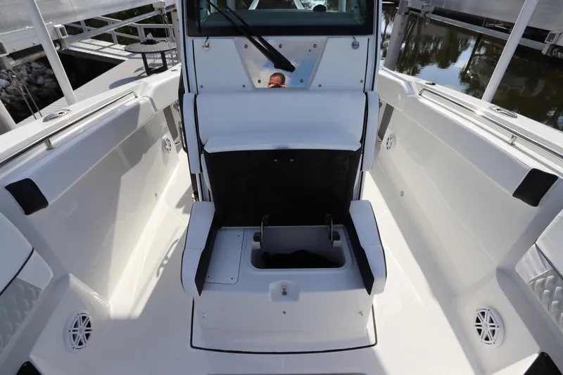 Slide: The Image of 2023 Blackfin 272 CC boat interior with open storage compartment. - 36