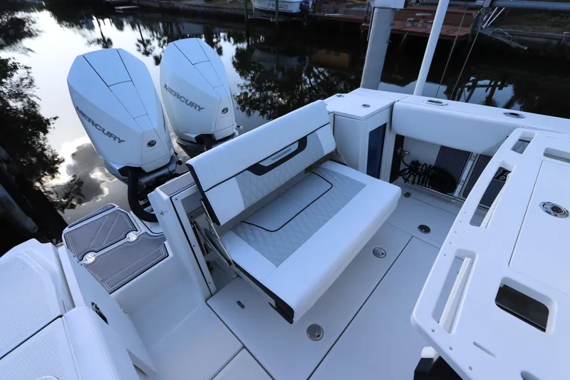 Slide: The Image of 2023 Blackfin 272 CC boat with dual Mercury engines and foldable seating. - 8