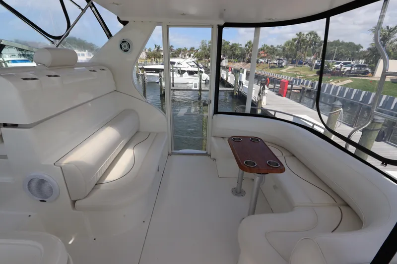 Slide: The Image of Luxurious interior of 2000 Cruisers Yachts 4450 Express Motoryacht with seating and table. - 12