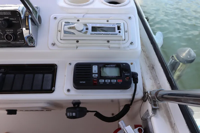 Slide: The Image of Control panel of a 2000 Cruisers Yachts 4450 Express Motoryacht with radio and audio system. - 23