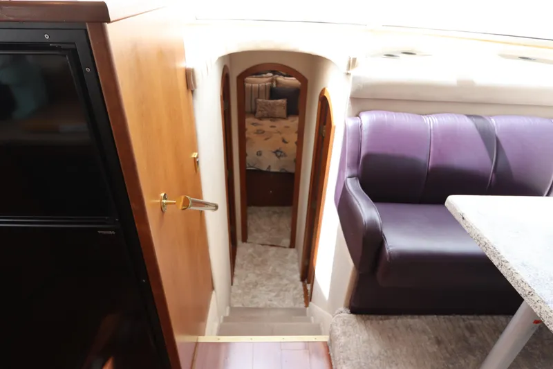 Slide: The Image of Interior of 2000 Cruisers Yachts 4450 Express Motoryacht with seating and cabin view. - 35