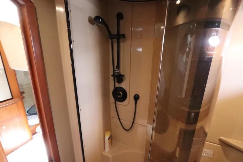Slide: The Image of Shower area in 2000 Cruisers Yachts 4450 Express Motoryacht, featuring modern fixtures and sleek design. - 39