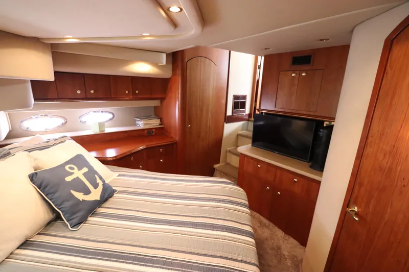 Slide: The Image of Luxurious cabin interior of 2000 Cruisers Yachts 4450 Express Motoryacht with nautical decor. - 45
